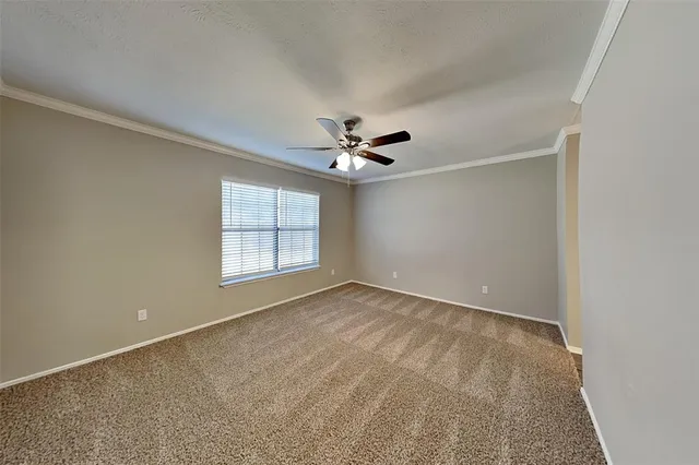 a view of a livingroom with a ceiling fan and window