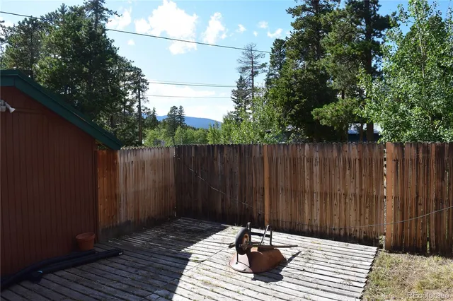a view of a deck with a backyard