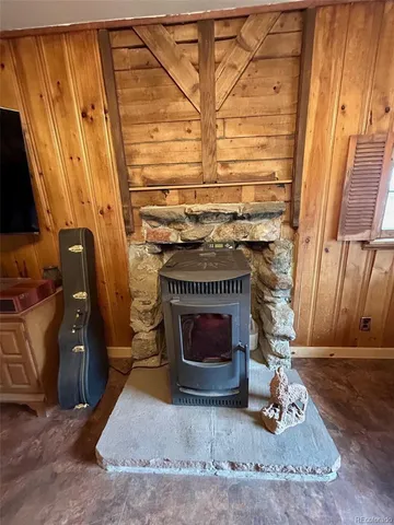 a living room with a fireplace and a wooden floor