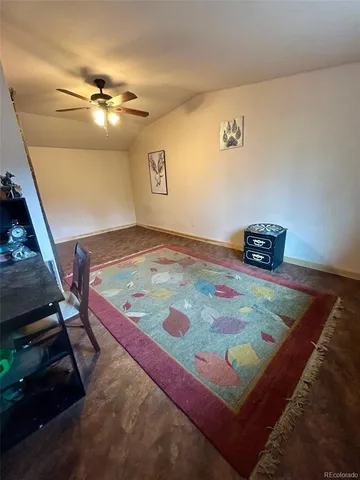 a bedroom with bed and window