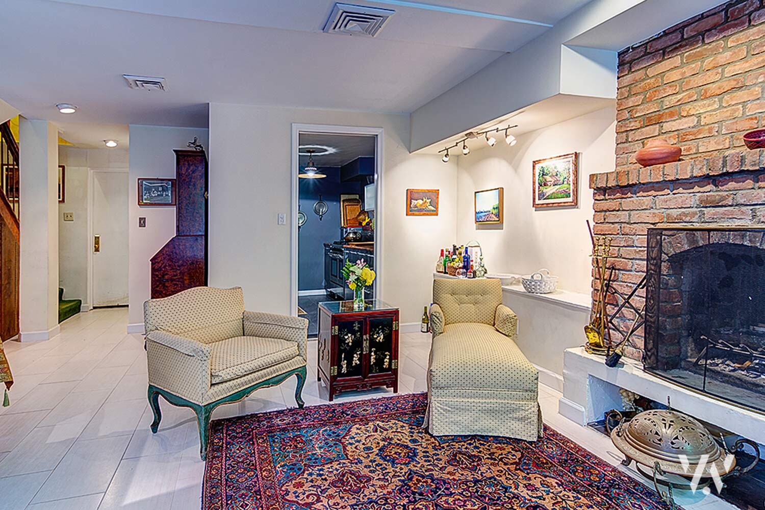 363 West 19th Street, Unit R Manhattan, NY 10011 - Photo 2 of 7 a living room with furniture and a fireplace