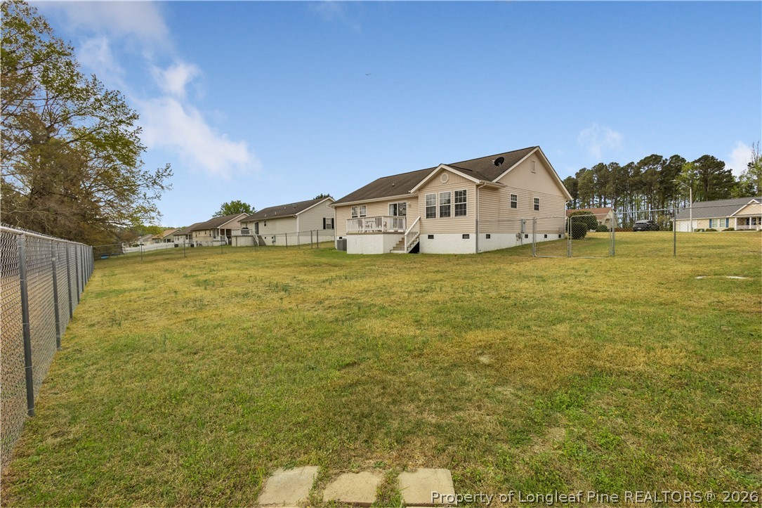 253 Farmstead Court Rockingham, NC 28379 - Photo 22 of 25 a view of a house with a yard