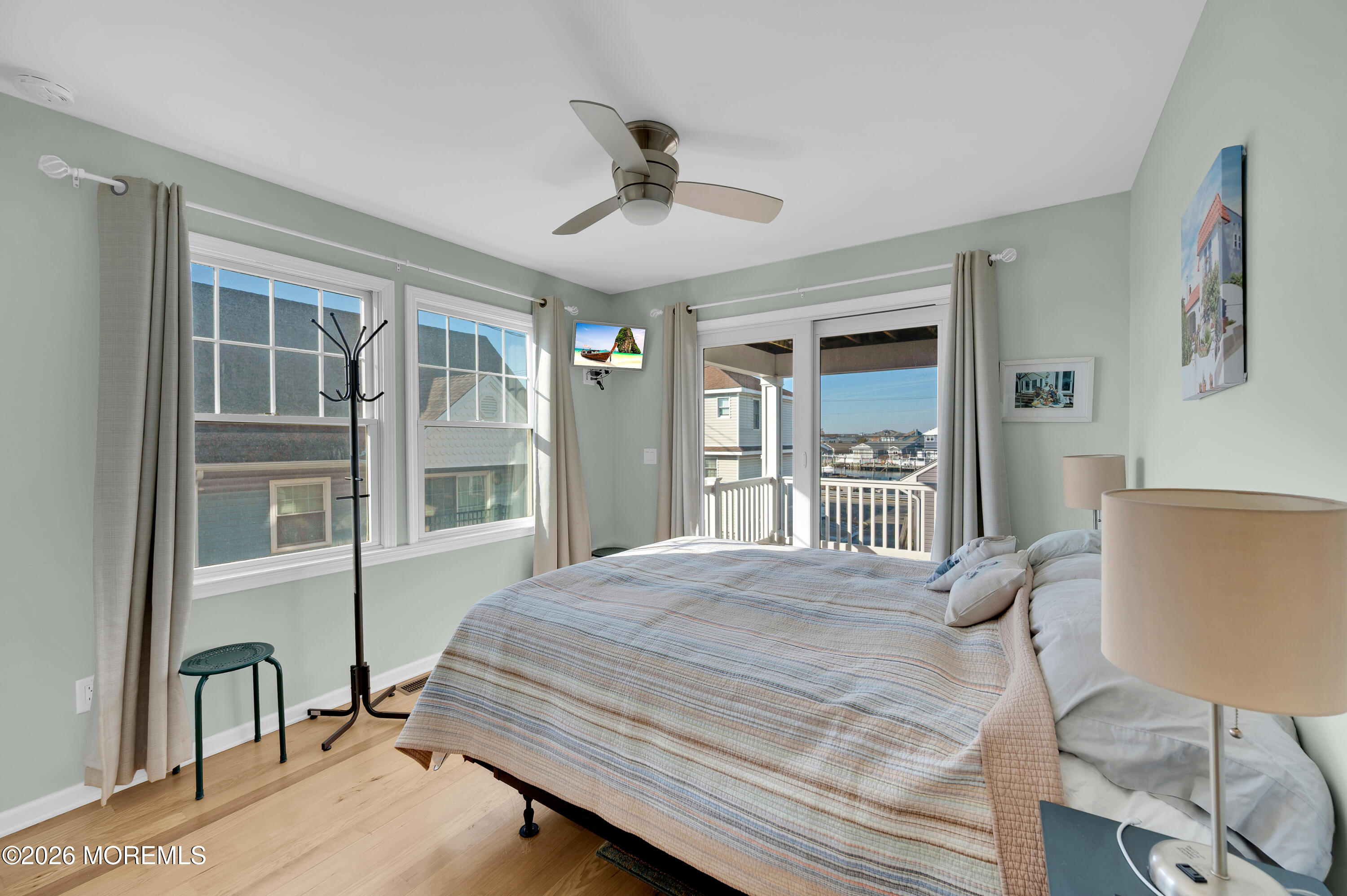 170 West Beach Way Lavallette, NJ 08735 - Photo 28 of 71 a bedroom with a bed and a large window with chair