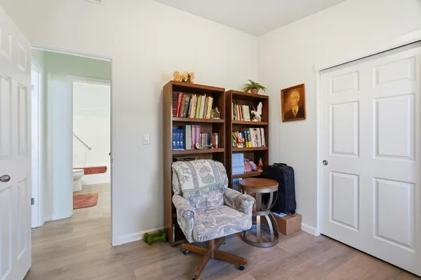a view of a workspace with furniture and lounge chair