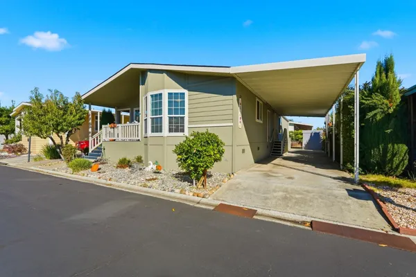 a view of a house with a street