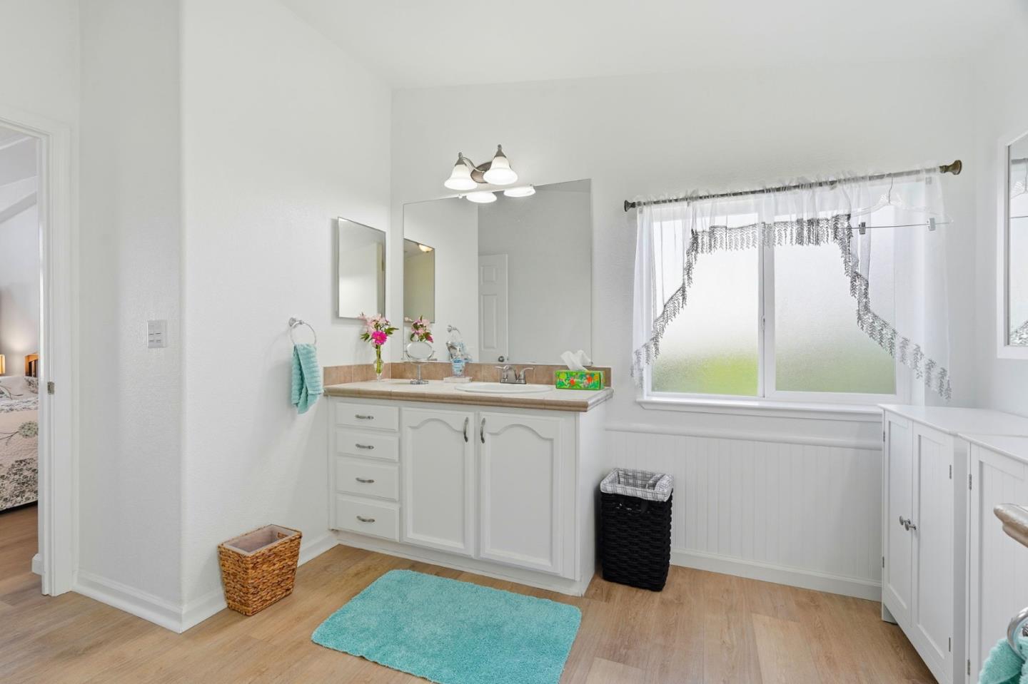 845 Villa Teresa Way, Unit 845 San Jose, CA 95123 - Photo 29 of 34 a spacious bathroom with a granite countertop sink and a mirror