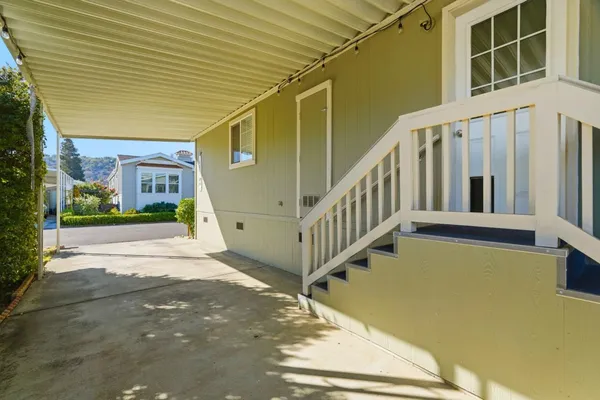 a view of a house with wooden stairs