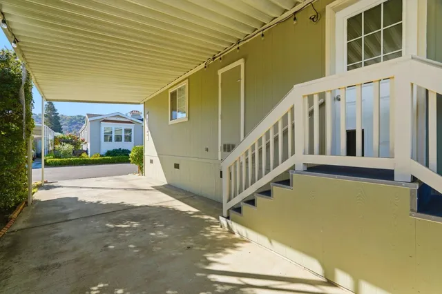 a view of a house with wooden stairs