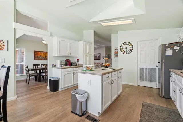 a kitchen with counter top space and cabinets