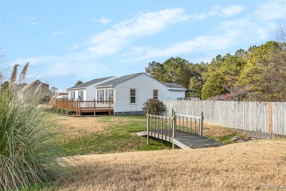 2912 Fielding Road Chester, VA 23831 - Photo 3 of 23 a view of a white house in front of a yard with wooden fence