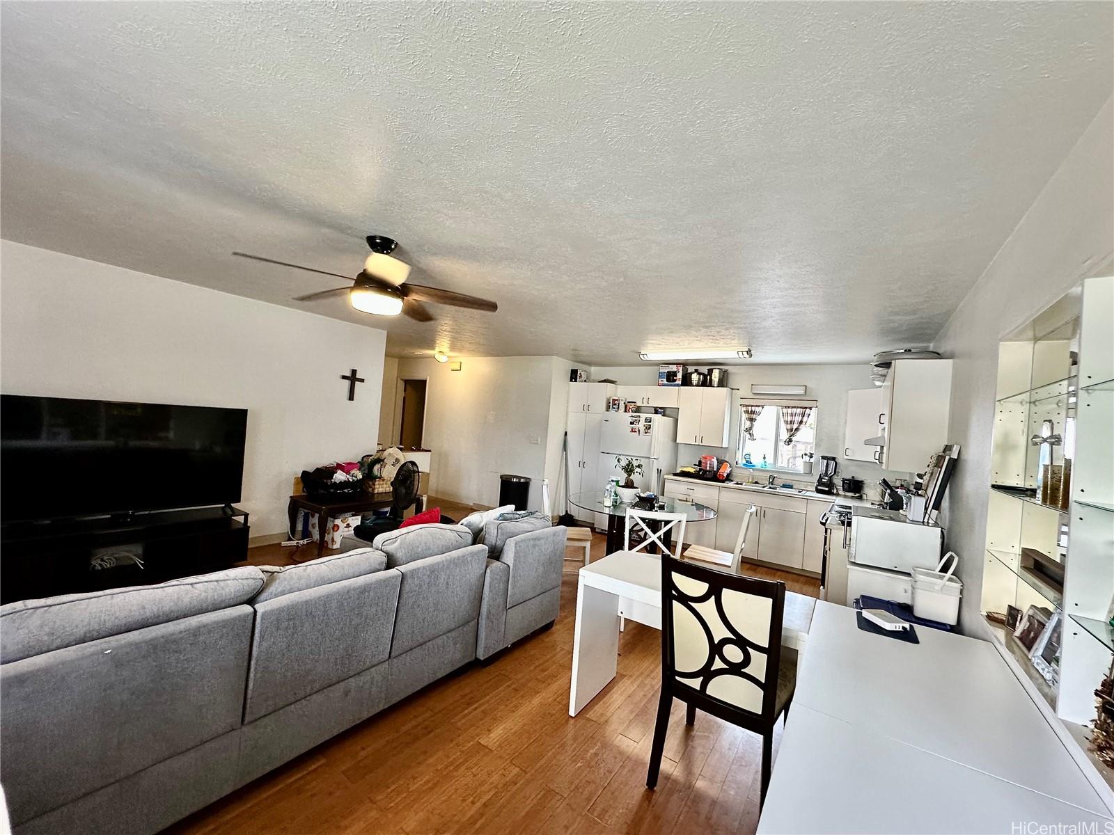 2205 Fern Street Honolulu, HI 96826 - Photo 8 of 13 a living room with furniture and a flat screen tv