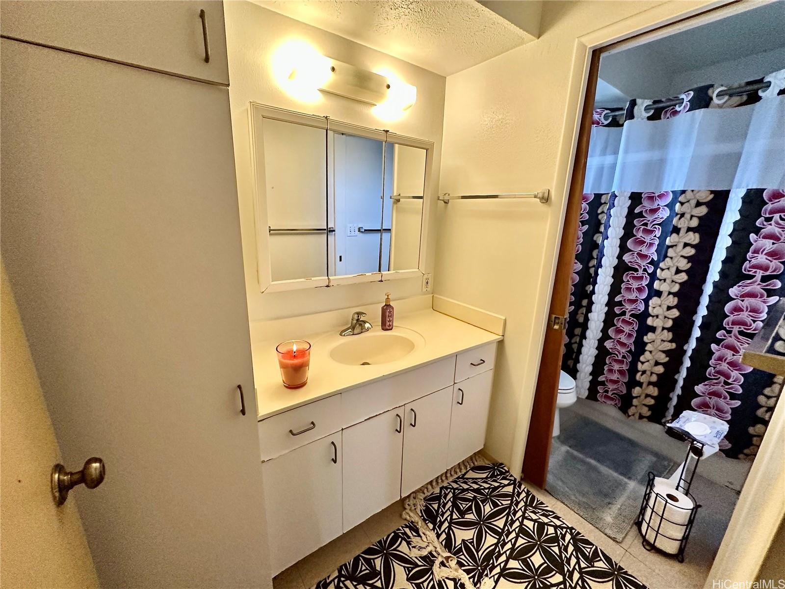 2205 Fern Street Honolulu, HI 96826 - Photo 9 of 13 a bathroom with a sink toilet and shower