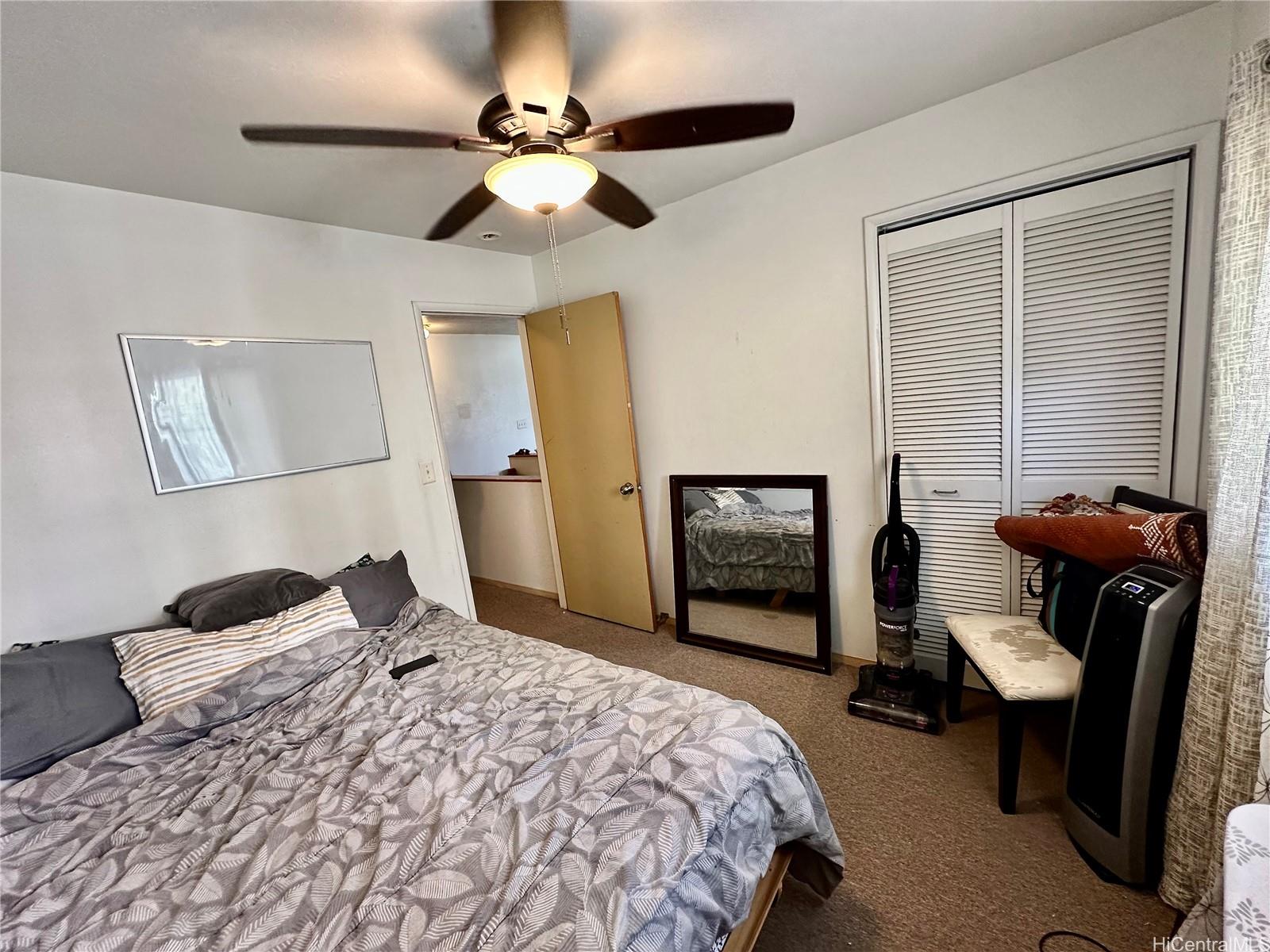 2205 Fern Street Honolulu, HI 96826 - Photo 10 of 13 a bedroom with bed and chair