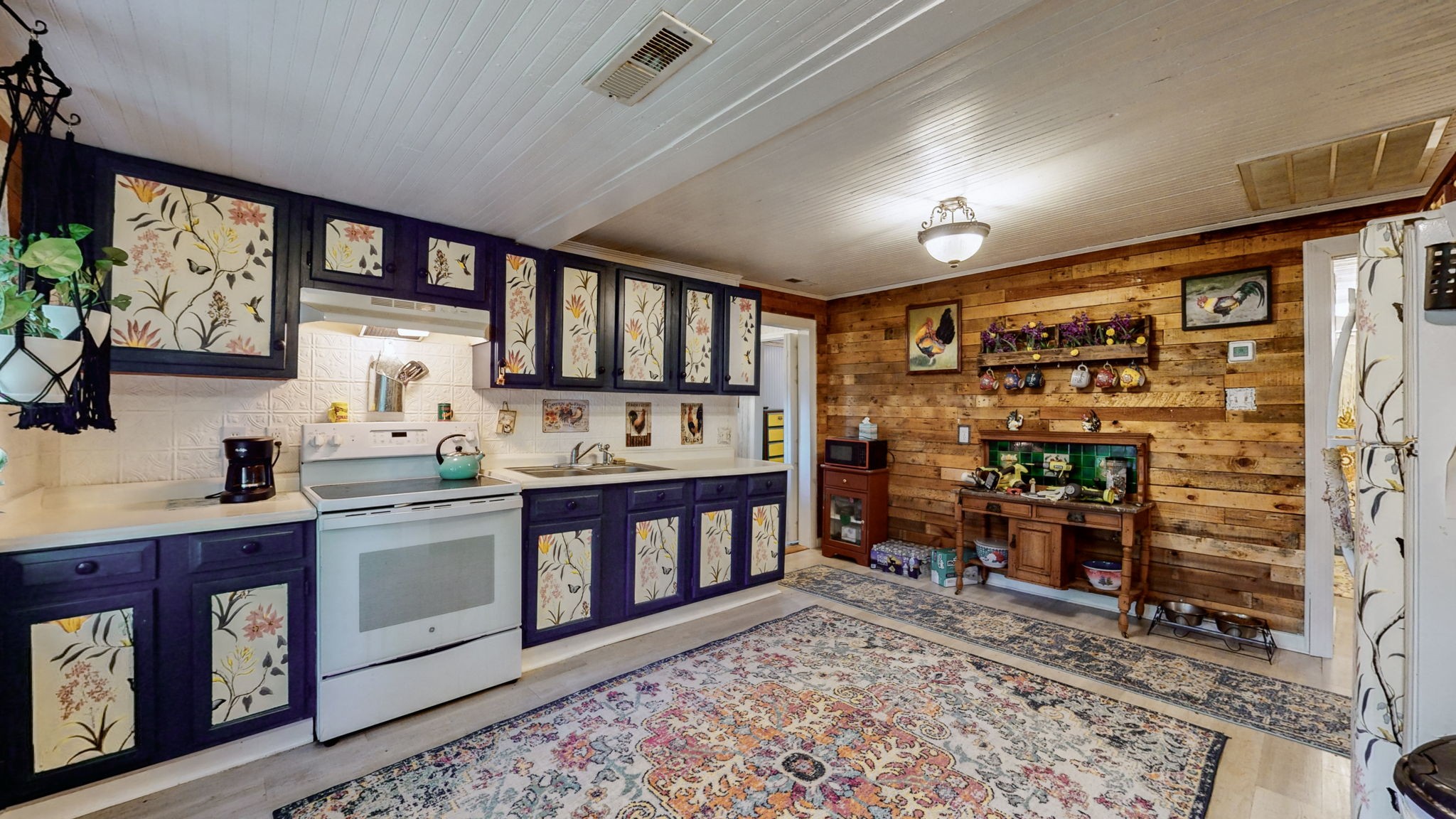 407 Villa Street Murfreesboro, TN 37129 - Photo 14 of 33 a kitchen with stainless steel appliances kitchen island granite countertop a refrigerator stove and sink