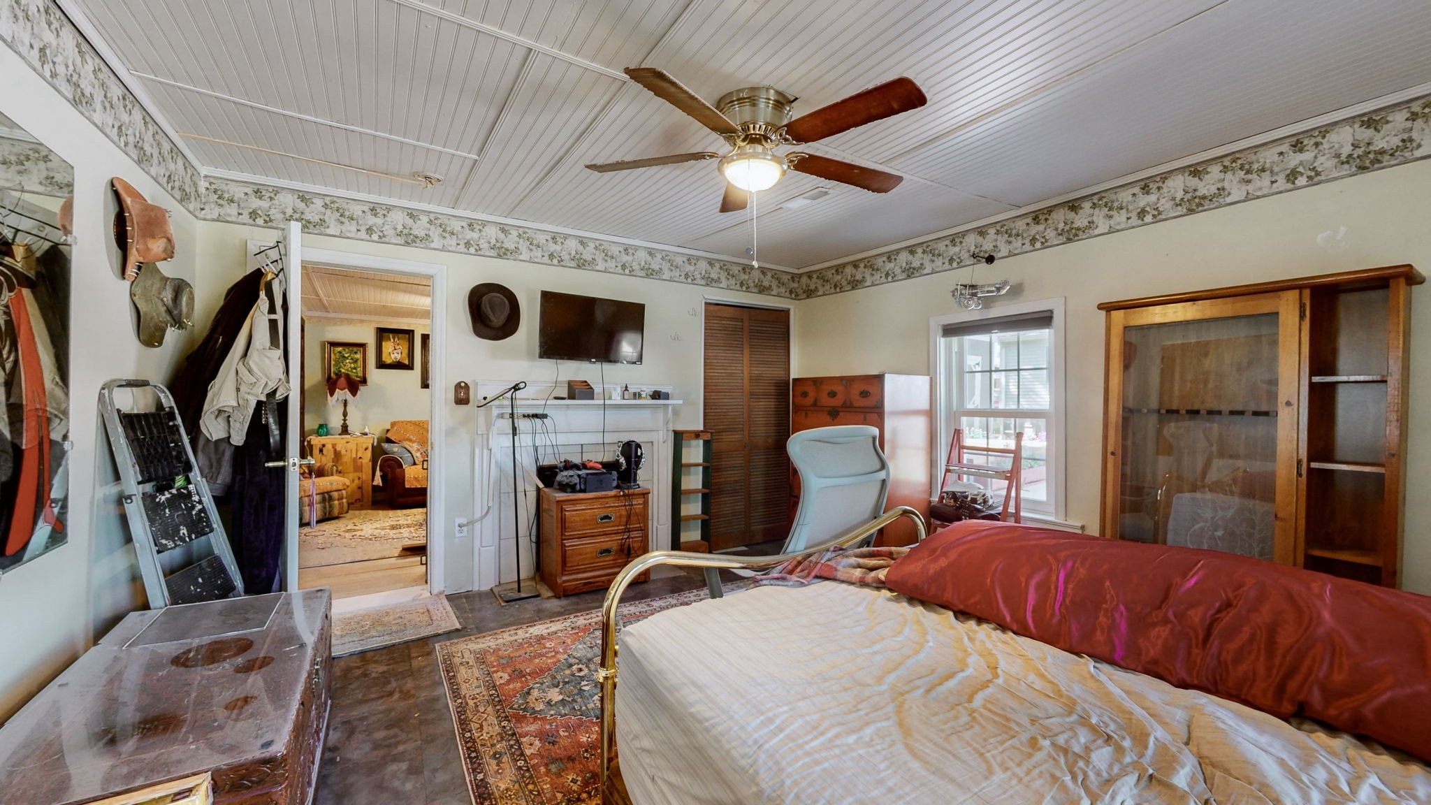 407 Villa Street Murfreesboro, TN 37129 - Photo 22 of 33 a bedroom with a bed a flat screen tv and a large window