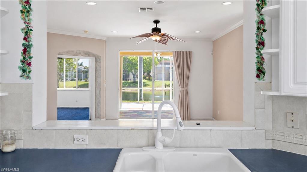 7737 Haverhill Court Naples, FL 34104 - Photo 14 of 37 Kitchen sink with a white faucet and dual basins