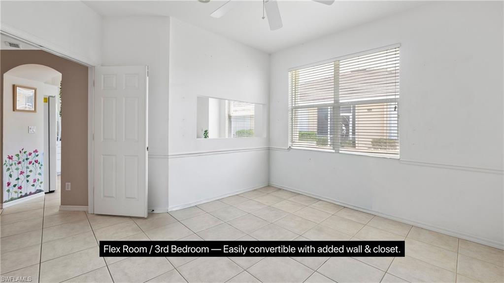 7737 Haverhill Court Naples, FL 34104 - Photo 19 of 37 Versatile room featuring tile flooring, a large window with horizontal blinds, and a ceiling fan