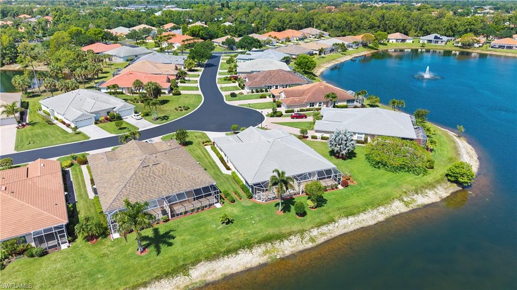 7737 Haverhill Court Naples, FL 34104 - Photo 35 of 37 Aerial perspective showcasing a residential community with a large body of water