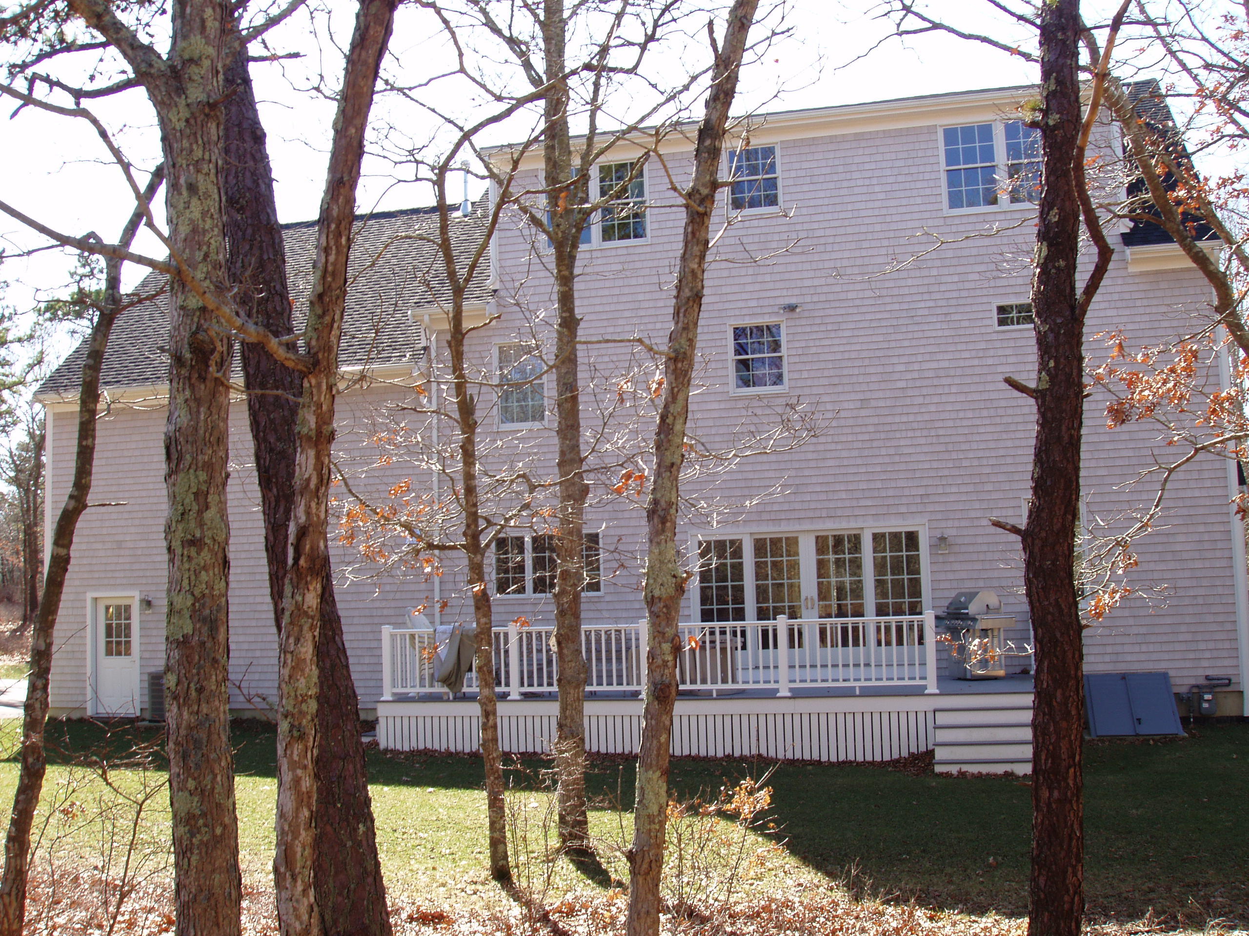 23 Harlow Road Sandwich, MA 02563 - Photo 2 of 44 a front view of a house with a yard