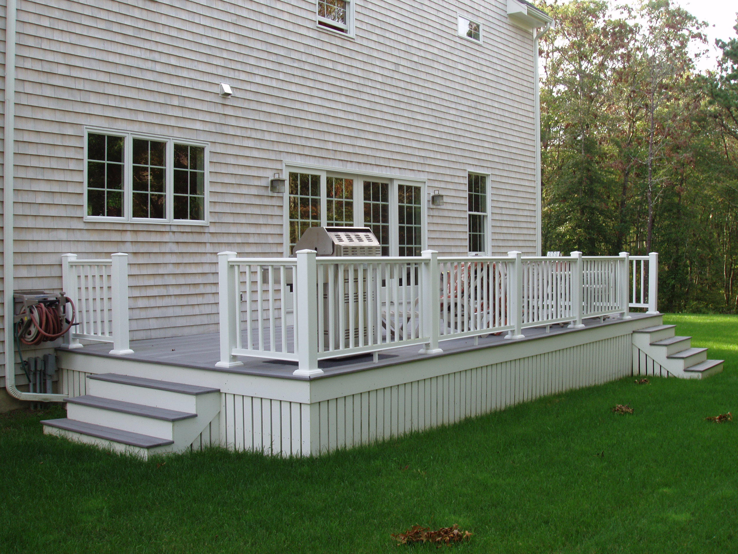 23 Harlow Road Sandwich, MA 02563 - Photo 3 of 44 a view of a house with a small yard and a large tree