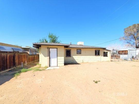 801 West Moyer Avenue Ridgecrest, CA 93555 - Photo 19 of 23 a front view of a house with a yard covered with snow