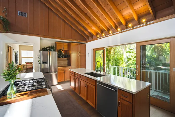 a view of a brick house with an ocean from balcony