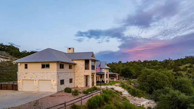 a view of a park with iron fence