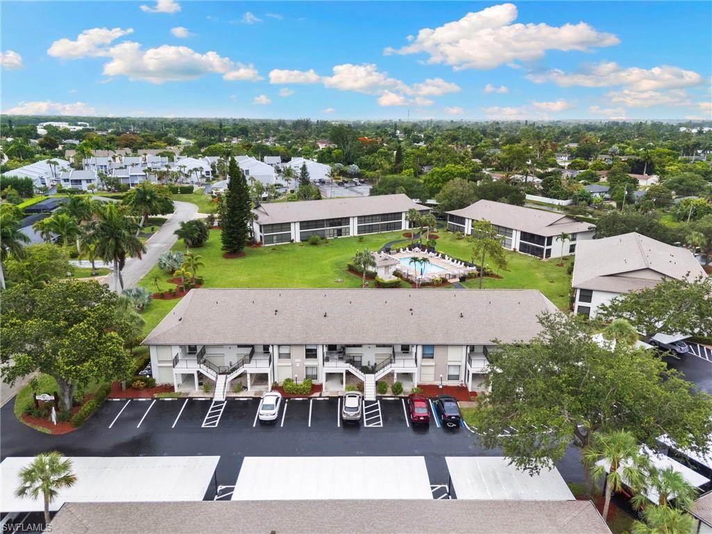 236 Pebble Beach Circle, Unit A202 Naples, FL 34113 - Photo 20 of 25 an aerial view of a house with a garden space