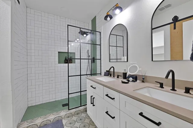 a bathroom with a double vanity sink mirror and double