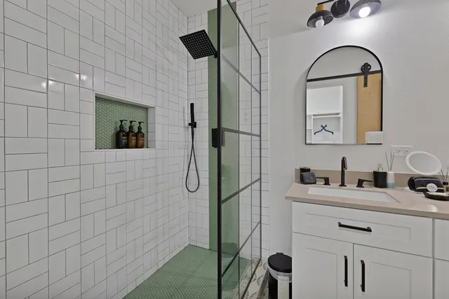 a bathroom with a sink a vanity and a mirror