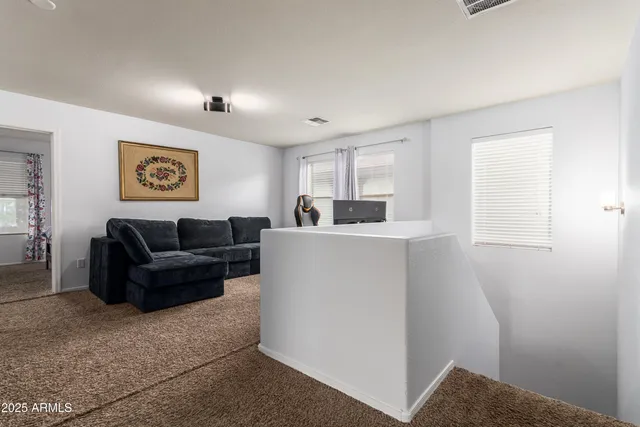 a work room with furniture and a window