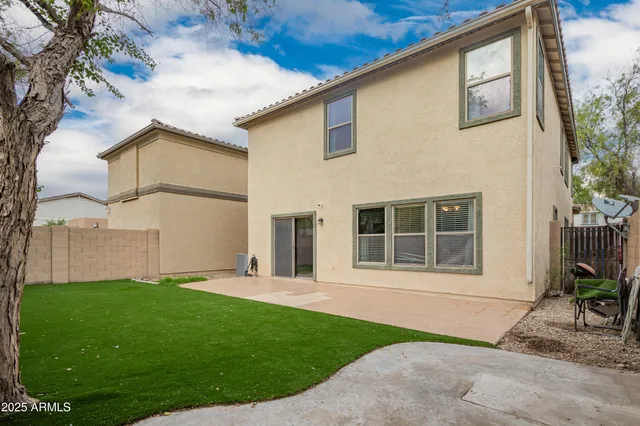 a house that has a big yard in front of it