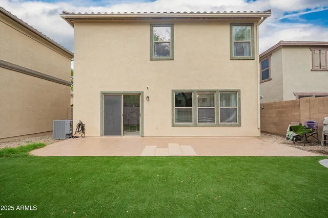 a front view of house with yard and outdoor seating