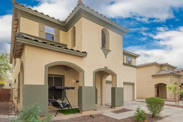 a front view of a house with yard