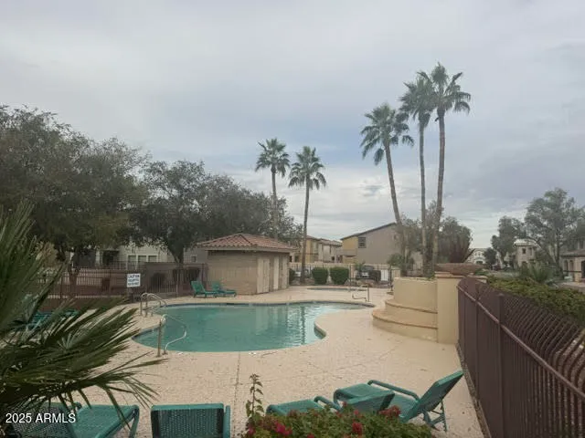 a house with palm tree in front of it