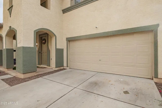 a living room with furniture a large window and a flat screen tv