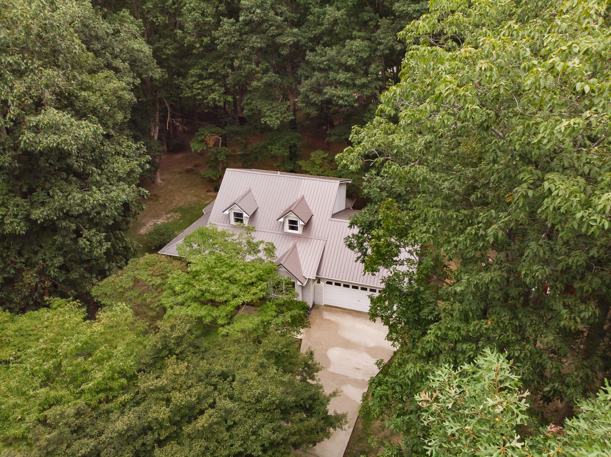 96 Smoke Rise Circle Manchester, TN 37355 - Photo 28 of 31 an aerial view of a house with a yard and large trees