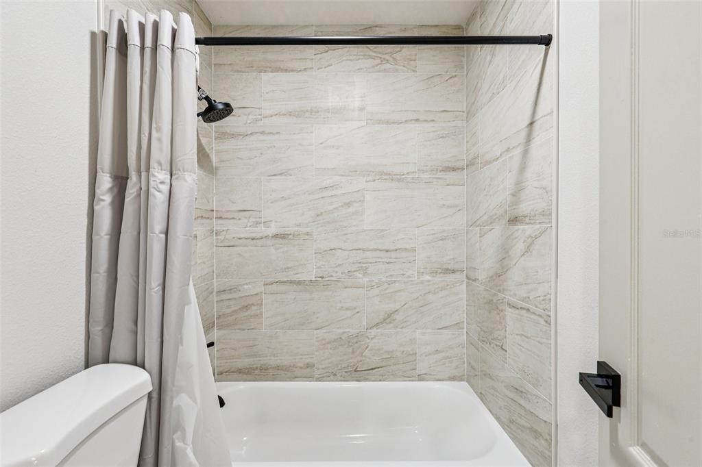 5 Watkins Place Palm Coast, FL 32164 - Photo 15 of 25 a bathroom with a shower