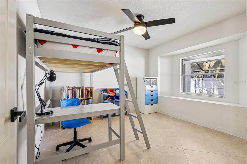 5 Watkins Place Palm Coast, FL 32164 - Photo 16 of 25 a view of a hallway with workspace and windows