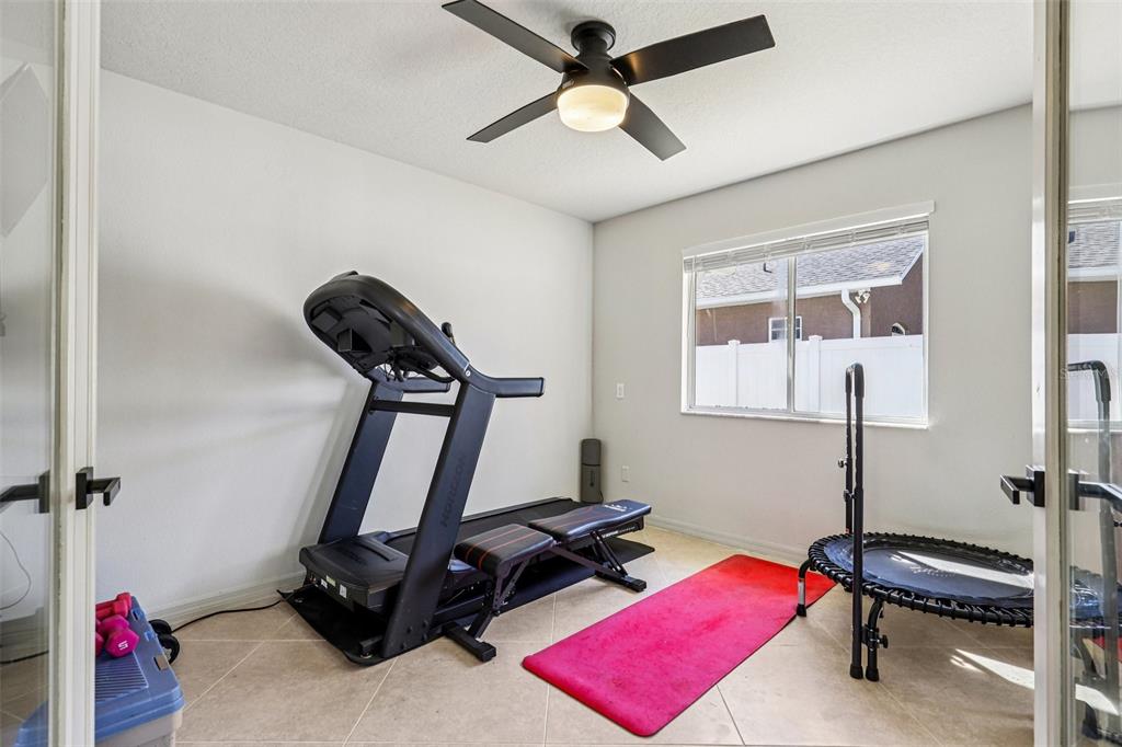 5 Watkins Place Palm Coast, FL 32164 - Photo 17 of 25 a room with gym equipment and a window
