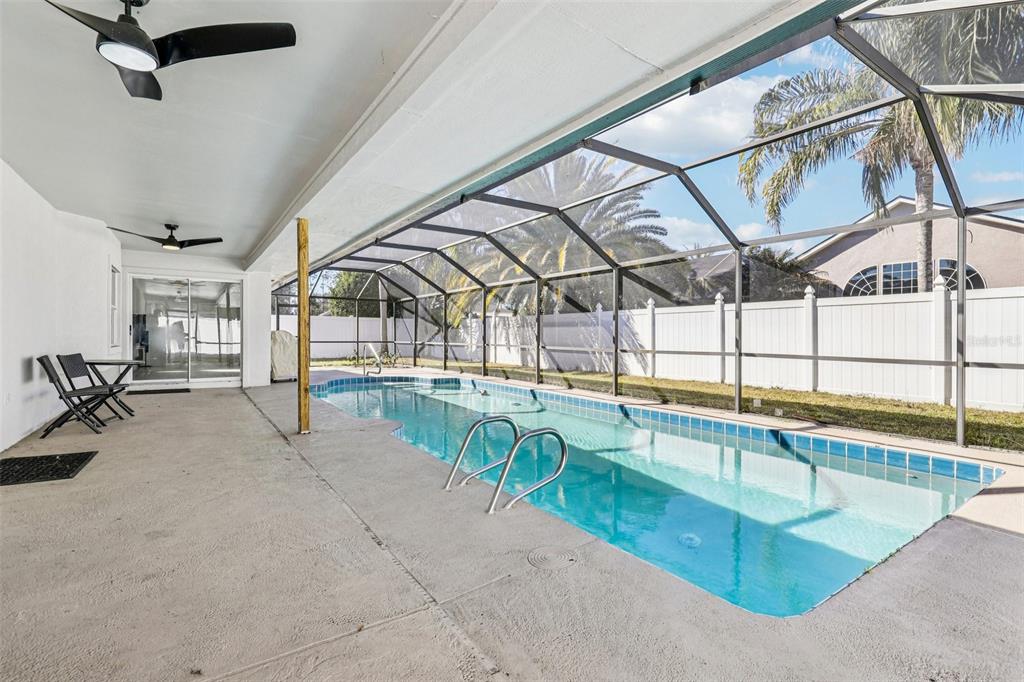 5 Watkins Place Palm Coast, FL 32164 - Photo 3 of 25 a view of a swimming pool with a lounge chair