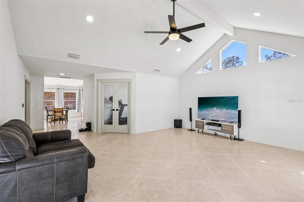 5 Watkins Place Palm Coast, FL 32164 - Photo 4 of 25 a living room with furniture and a flat screen tv