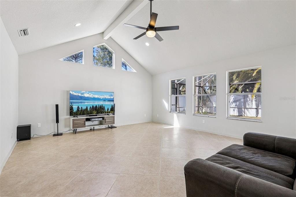 5 Watkins Place Palm Coast, FL 32164 - Photo 5 of 25 a living room with furniture and a flat screen tv