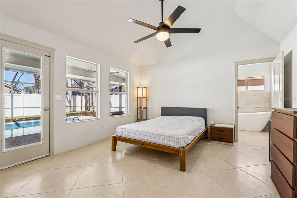 5 Watkins Place Palm Coast, FL 32164 - Photo 10 of 25 a bedroom with a bed and window