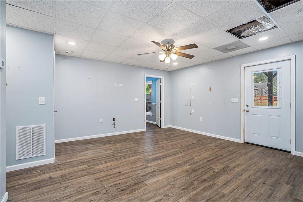 115 Floating Leaf Way Dallas, GA 30132 - Photo 31 of 47 an empty room with wooden floor and ceiling fan