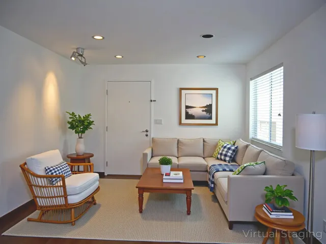 a living room with furniture and a potted plant