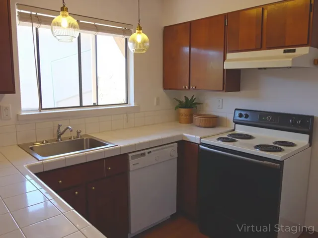 a kitchen with a sink stove and cabinets