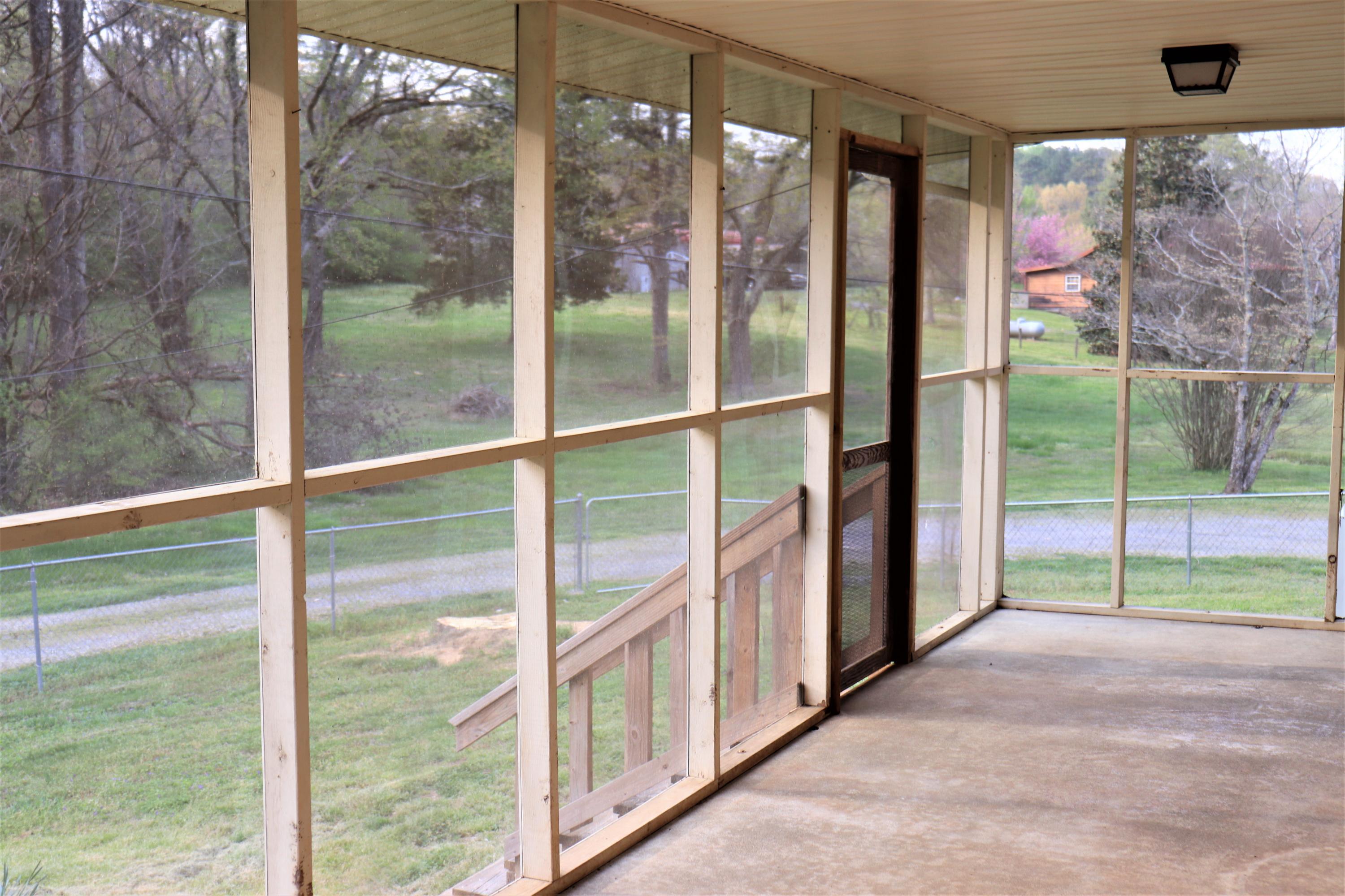 1076 Bancroft Road McDonald, TN 37353 - Photo 18 of 24 3 - screen porch frm end to door