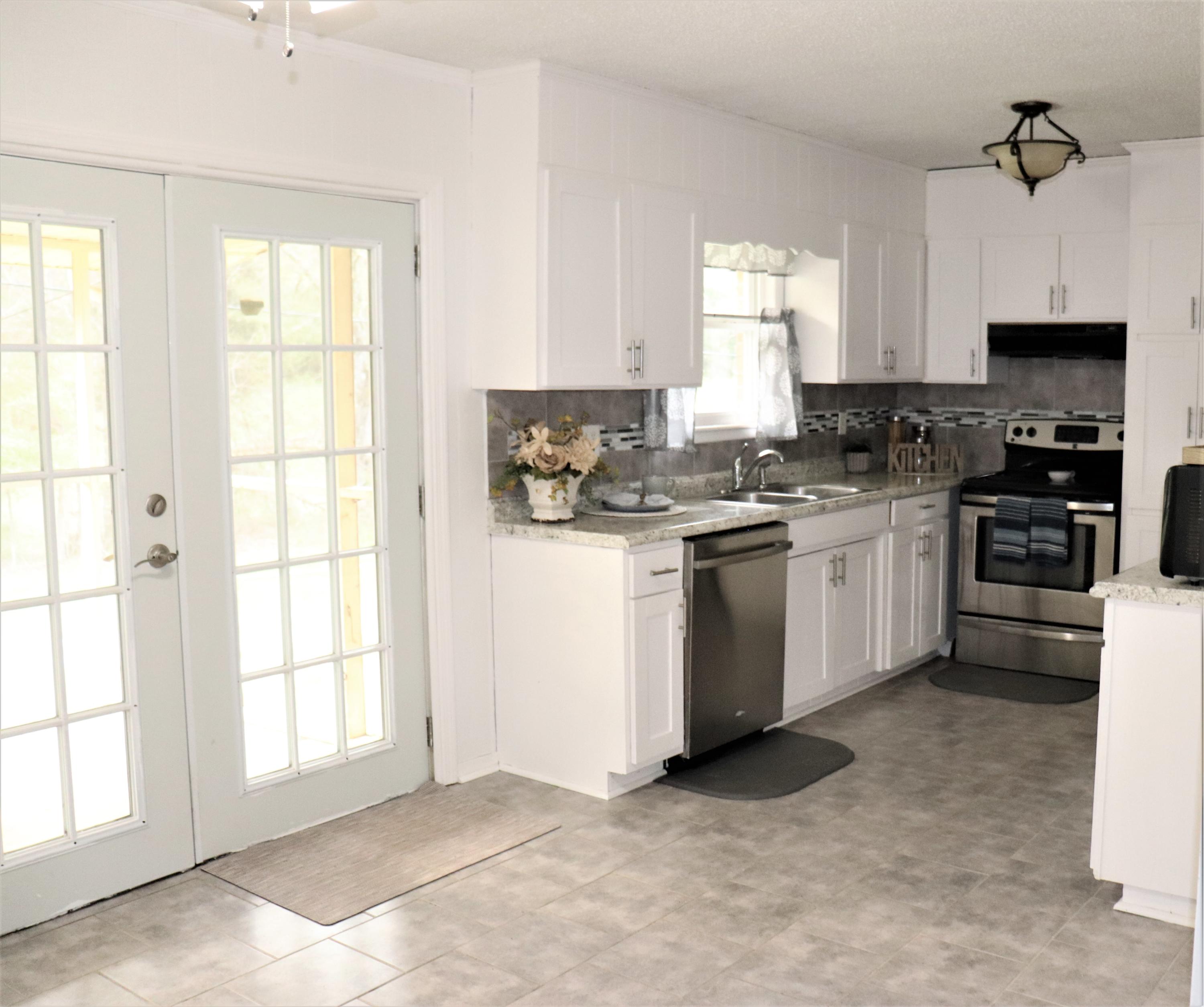 1076 Bancroft Road McDonald, TN 37353 - Photo 7 of 24 3 - kitchen and doors to porch