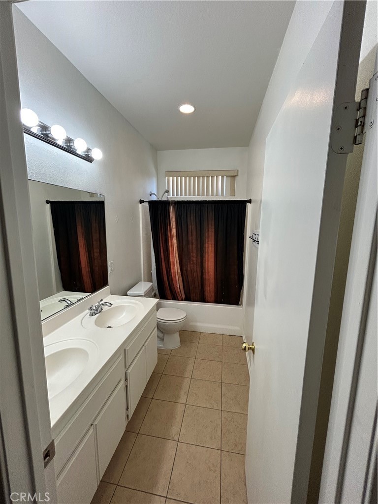 12673 Field Way Victorville, CA 92395 - Photo 15 of 15 a bathroom with a sink a toilet and mirror
